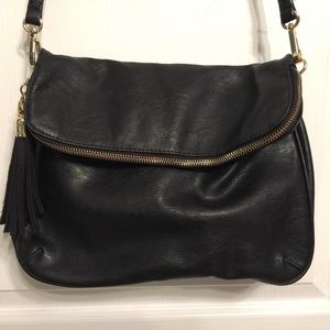 Black convertible handbag with cute tassel detail